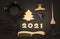 Accessories for hair coloring, numbers 2021 and a Golden Christmas tree. Black and gold color items, new year theme for