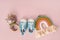 Accessories toys and small sneakers for newborns on a pastel background with an empty space for text. Cute concept of childhood an