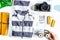 Accessories for treveling with children, camera and suit on whit