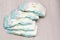 Accessory set for Baby disposable diapers on gray background tree, items for baby care. Lay diaper nappy, the parent taking care
