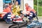 Accident bike woman get emergency help paramedics