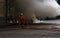 Accident in the streets of Paris . Some Firemen extinguishing the fire of the car