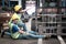 Accident at workplace, industrial engineer worker wearing helmet hit by forklift car at manufacturing plant factory construction