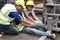 Accident at workplace, industrial engineer worker wearing helmet hit by forklift car at manufacturing plant factory construction