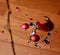 accidentally broken new year red ball, on a wooden floor background and preparation for the new year celebration