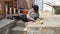 Accidents while cleaning domestic house where a caucasian girl falls off the ladder with broom and dustpan and bucket of water