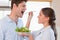 Accomplice couple tasting a salad