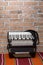 Accordion by the old retro brick wall