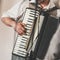 Accordionist plays vintage accordion