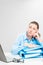 Accountant in blue shirt with documents thoughtful sitting