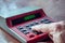 Accountant`s hand on the keyboard of an old Soviet  calculator