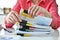 Accountant woman searching in stack of documents