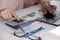 Accountants work analyzing financial reports on a laptop at his office, business analytics concept