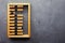 Accounting abacus on gray textured background