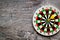 Accuracy of precision concept. Dartboard and arrows on grey background top view copy space