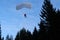 Accuracy skydiving. Skydiver is landing in the forest.