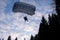 Accuracy skydiving. Skydiver is landing in the forest.