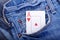 Ace of hearts in blue jeans pocket
