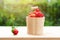 Acerola cherry in wooden bucket on wooden background. Select  focus, Barbados cherry, Malpighia emarginata, high vitamin . Acerola