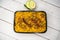 Achari beef khichuri biryani rice pulao with cucumber and lemon slice served in dish isolated on wooden table top view of
