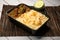 Achari beef pulao biryani rice with cucumber and lemon slice served in dish isolated on wooden table side view of bangladeshi and