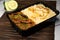 Achari beef pulao biryani rice with cucumber and lemon slice served in dish isolated on wooden table side view closeup of