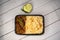 Achari beef pulao biryani rice with cucumber and lemon slice served in dish isolated on wooden table top view of bangladeshi and