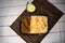 Achari beef pulao biryani rice with cucumber and lemon slice served in dish isolated on wooden table top view closeup of