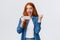 Achievement, goal and success concept. Cheerful happy cute redhead teenage girl fist pump triumphing, staring at