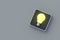 Achieving success. Glowing light bulb on button