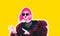 Acid crazy hot beautiful rock Girl in bright pink wig and sunglasses in lama leather swag style red fur winter coat