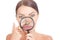 Acne blackheads on woman`s nose showed in a magnifying glass