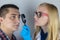 Acne close-up. A man is being examined by a doctor. Dermatologist examines the skin through a magnifier, a magnifying glass