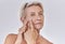 Acne or pimple popping senior woman while doing a skincare beauty treatment for healthy and clear skin. Portrait of