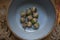 Acorns from an Oak Tree in a Blue Clay Bowl