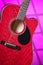 Acoustic Electric Red Guitar on Pink