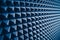 Acoustic foam material for sound dampering, blue background