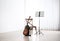 Acoustic guitar, chair and note stand with music sheets