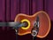 Acoustic guitar, clef and microphone on a curtain background 3d