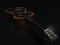 Acoustic guitar and concert microphone on a dark background 3d