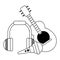Acoustic guitar microphone and music headphones in black and white