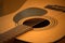 Acoustic guitar photo in cozy, warm tones