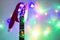 acoustic guitar with red Santa hat and light colorful garland. Christmas music concept