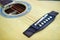 Acoustic guitar strings on wooden table in the room, close up top view and sunlight with empty space for you text