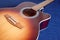 Acoustic guitar top with six strings isolated closeup