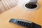 Acoustic guitar on a wooden background with copy space.The guitar is a fretted musical instrument that usually has six strings