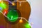 Acoustic guitar wrapped by colorful garland. christmas and new year music gift