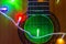Acoustic guitar wrapped by colorful garland. christmas and new year music gift