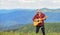 Acoustic music. Musician hiker find inspiration in mountains. Keep calm and play guitar. Man with guitar on top of