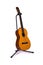 Acoustic spanish guitar on stand